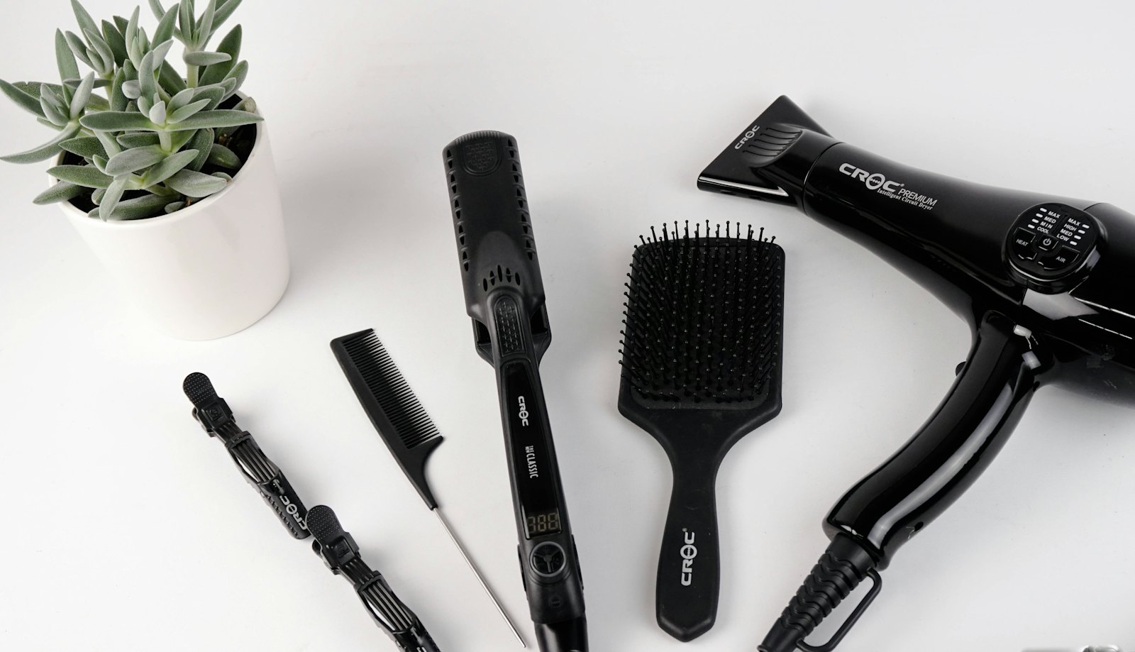 Salon tools beside a green plant