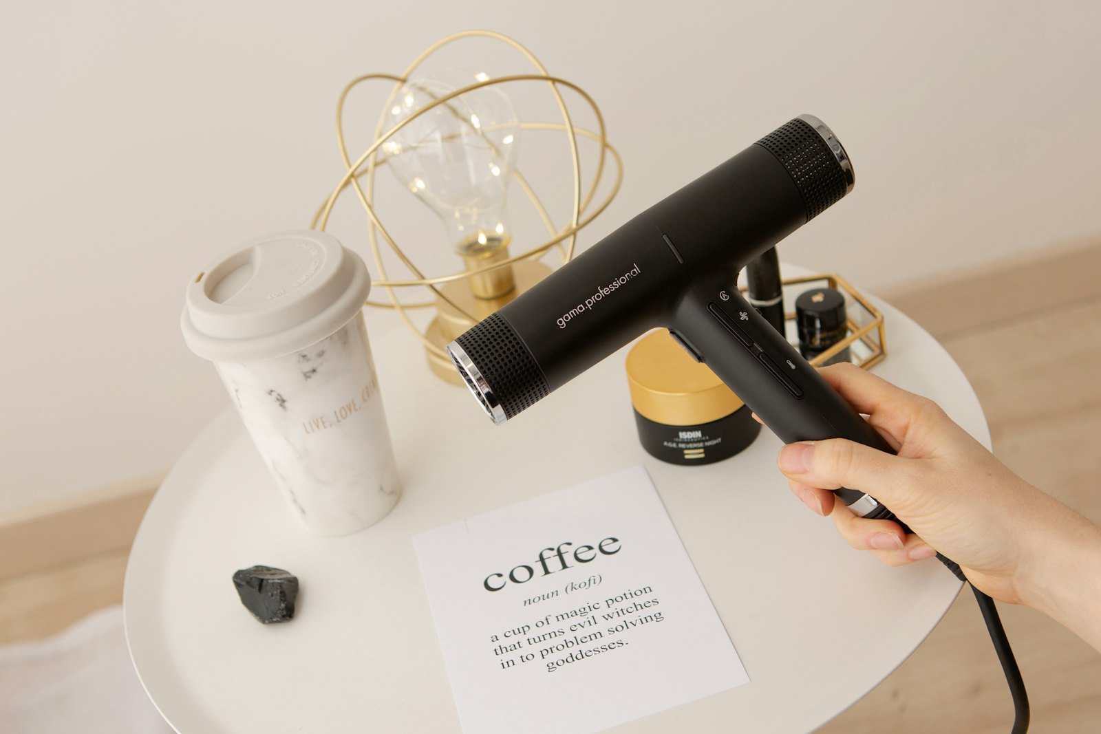 Coffee served beside a hair dryer
